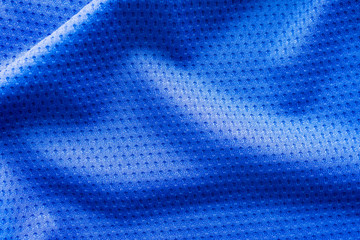 Blue color fabric sport clothing football jersey with air mesh texture background