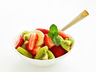 Wall Mural - Summer salad with strawberries, kiwi and banana.