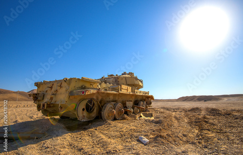 destroyed tank under desert sun landscape buy this stock photo and