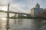 Fototapeta Nowy Jork - Morning sun shining through Manhattan Bridge over the Hudson river 