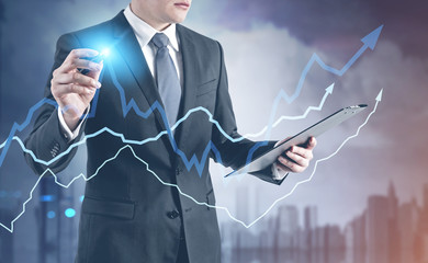 Poster - Businessman with a glowing pen, city grow graphs