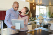 © auremar - positive young couple in kitchen store