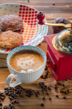 Red Coffee Mill, Cup Latte With A Painted Cat On Milk Foam And Biscuits On A Old Wooden Table.