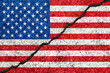 United States flag painted on cracked wall background/USA divided concept