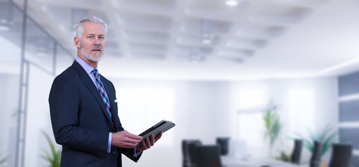 Wall Mural - Senior businessman in his office