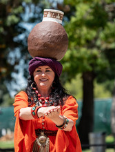 Female Belly Dancer With Water Jug On Turban Head Pirate Festival