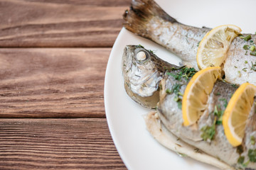 Wall Mural - Fish dish on a white plate.