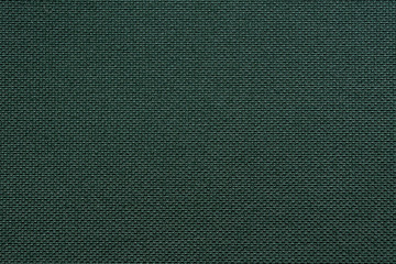 texture of dense dark green fabric closeup