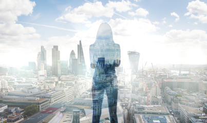 Poster - Young woman in suit looking over the City of London at sunrise 