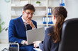 © Elnur - Disabled businessman having discussion with female colleague