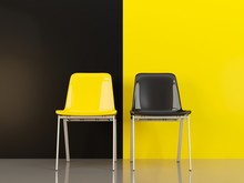 Two Chairs In Front Of Black And Yellow Wal