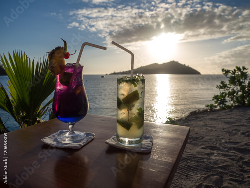 Colourful Cocktail Drinks With Straws Looking At Landscape View Of Tropical Ocean Island Sunset On Beach Buy This Stock Photo And Explore Similar Images At Adobe Stock Adobe Stock