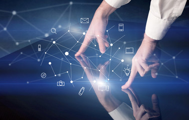 Poster - Male hands touching interactive table with blue mixed communication icons in the background