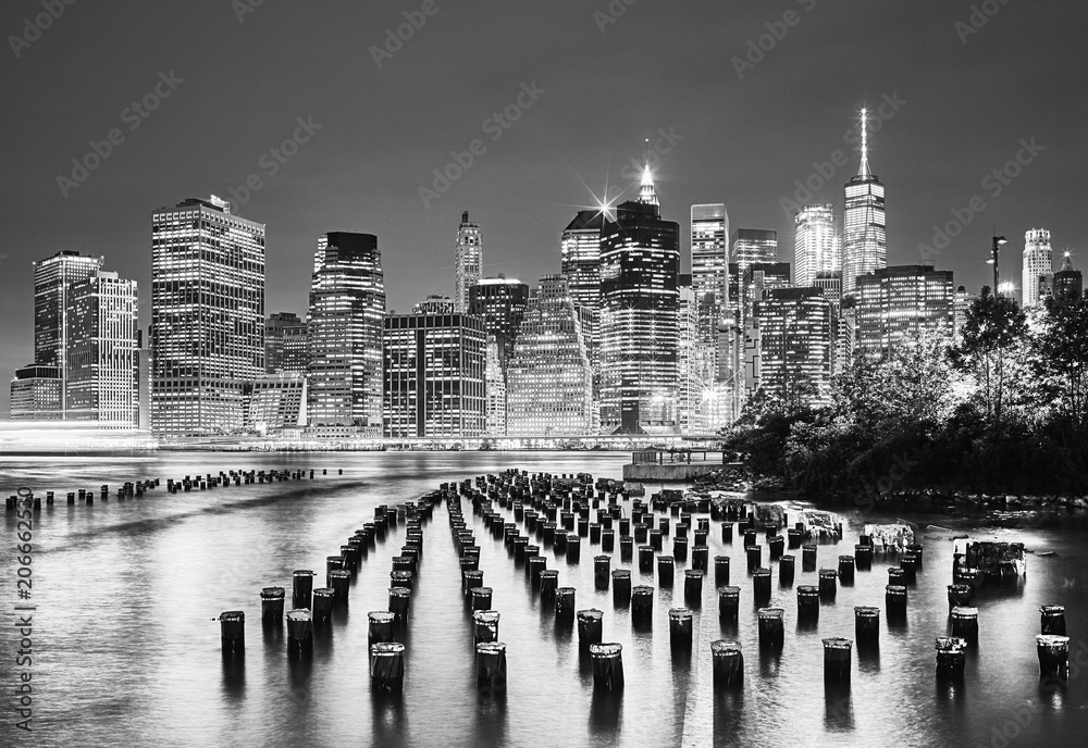 Black and white picture of the New York City at night, USA. - obrazy, fototapety, plakaty 