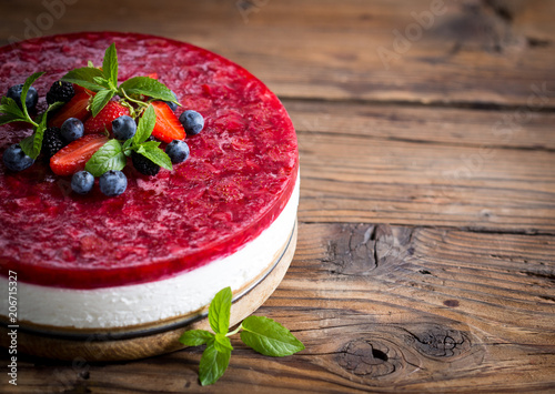 Fotografering  Homemade cheesecake with fresh berries