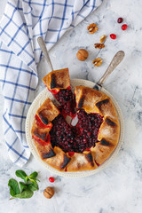 Wall Mural - Sliced homemade berry pie (galette) on a white plate.