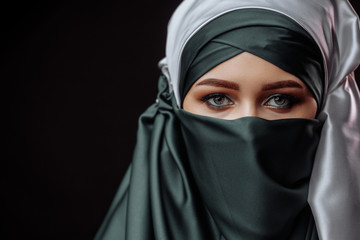 islamic style in clothes. Mohammedian with elegant appearance isolated on the black background. copyspace