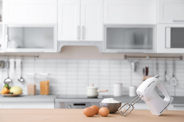 Sticker - Products, mixer and blurred view of kitchen interior on background