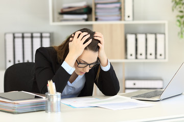Wall Mural - Depressed office worker reading sales reports