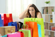 Surprised woman looking at multiple purchases