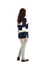 Canvas Print - full length portrait of girl wearing striped blue and white jumper and jeans. standing pose  facing away from the camera, on white studio background