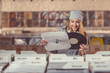 © AboutLife - Smiling girl in a vinyl record store