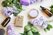 © marrakeshh - Organic skincare and spa products with lilac flowers, bath salt and oil bottles , natural soap , home-spa setting still life, organic products for body and skin