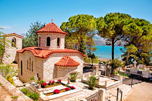 Beautiful Landscape With An Ancient Church At The Cemetery Near The Sea In Argostoli, Kefalonia, Greece.  Stunning Amazing Charming Places. Prominent Tourist Towns.