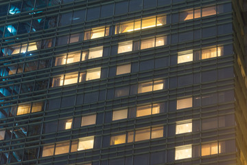 Wall Mural - Rent and sale real estate windows at night in highrise building.