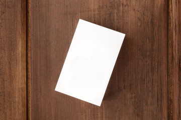 Wall Mural - White business card mockup on a dark background, overhead photo with copy space