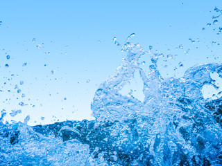 splashing water of sea wave isolated on gradient blue background with clipping path