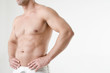 © vladorlov - Sexy athletic man. Gray background.