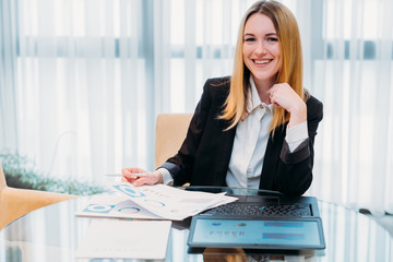 Wall Mural - business lady at work. company manager. woman looking through documents in office. professional corporate dresscode