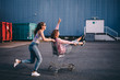 © Criene Images - Young adult hipster friends having fun with shopping trolley