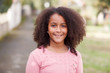 © Gelpi - Cute African American girl in the street with afro hair