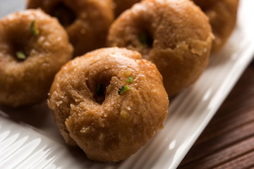 Balushahi sweet food served in a white or golden plate over moody background