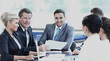 © ASDF - business partners and business team discussing business issues in office