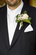 © Belphnaque - Groom clothes detail, bright white shirt and neck tie, black suit, white rose and lily of the valley