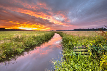 Wall Mural - Warm indian summer sunrise over lowland river