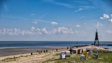 Sandy beach under vivid blue sky on a warm and sunny day in Cuxhaven