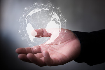 Leinwandbilder - Businessman hand with virtual button on Earth map point with network connection, international meaning