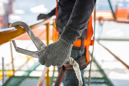 Fotomural Construction worker wearing safety harness and safety line working on constructi