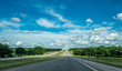 © Maryna Konoplytska - Rural road in Texas, USA. Agricultural landscape and blue sky