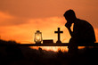 boy reading bible and praying on wood , christian silhouette concept.