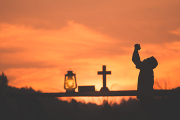 Wall Mural - boy worship and praying to god, christian concept.