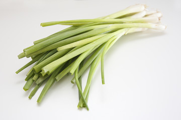 Wall Mural - Detail of fresh chives on a white background