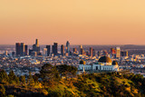 Fototapeta  - Los Angeles skyscrapers and Griffith Observatory at sunset