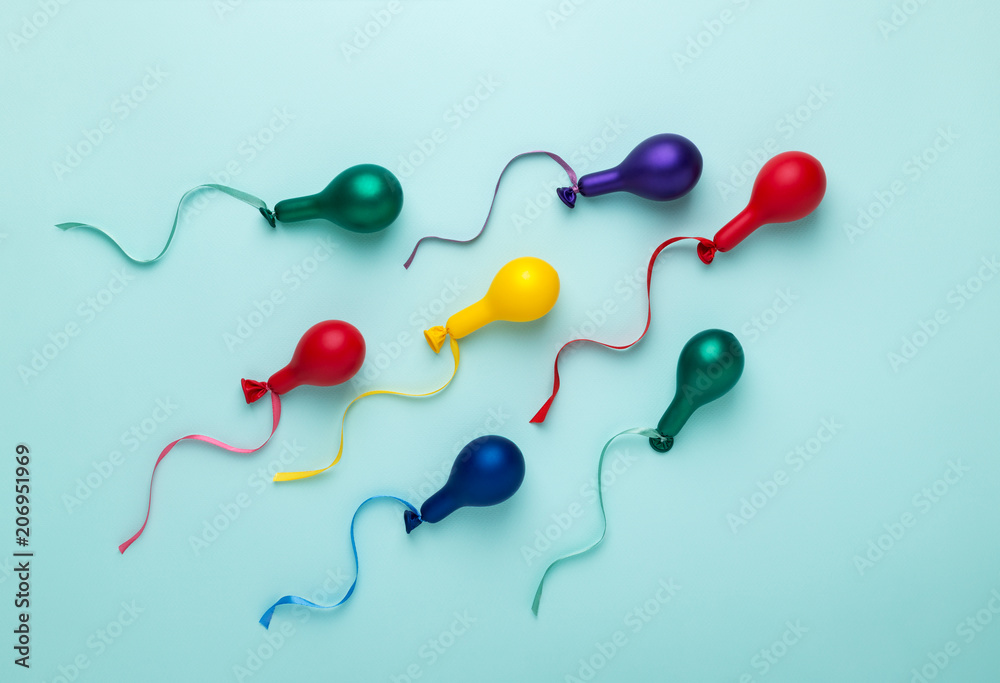 Motion of Colorful balloons in spermatozoid shape concept. - obrazy, fototapety, plakaty 