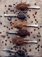 Different Kinds Of Coffees On The Spoons (coffee Beans, Ground Coffee, Instant Coffee)