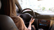 © motortion - Young woman driving car in city, urban lifestyle, compliance with traffic rules